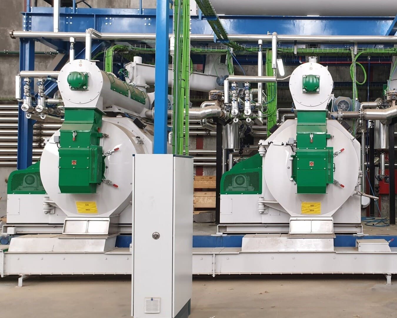 Two Mabrik green and white pelletizers in a feed mill